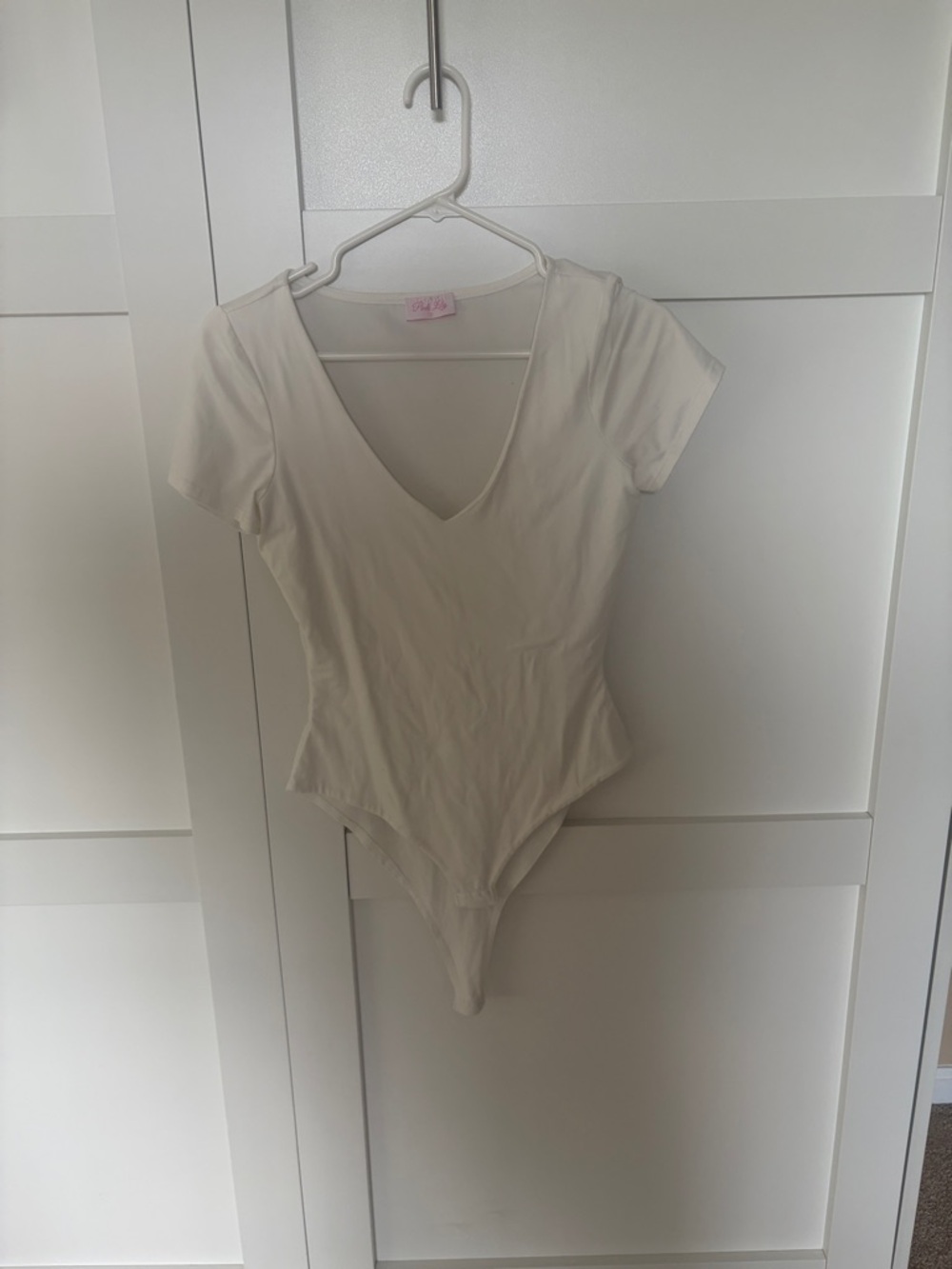 Pink Lily Cream V-Neck Short Sleeve Bodysuit